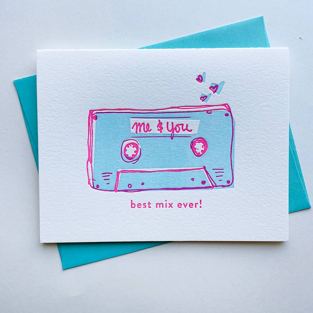 Hand drawn cassette tape in blue with pink borders. Text in pink.