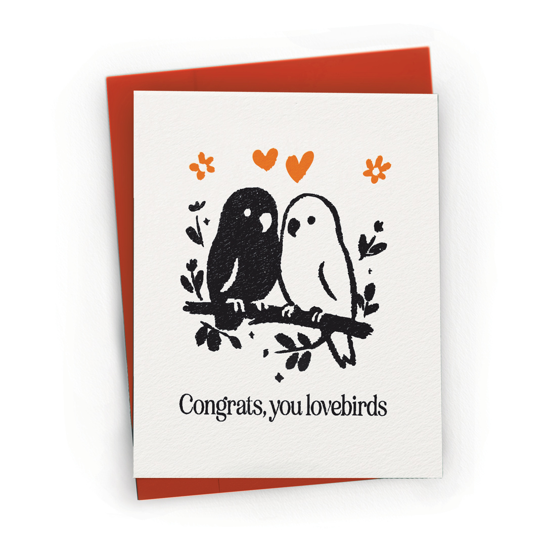 Greeting card with lovebirds illustration and 'Congrats, you lovebirds' text on a white background.