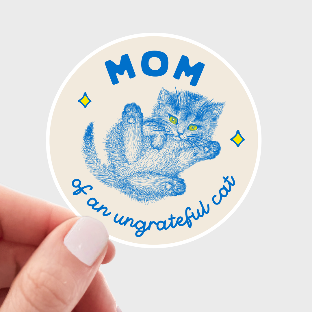 Circular sticker with blue cat illustration and blue text