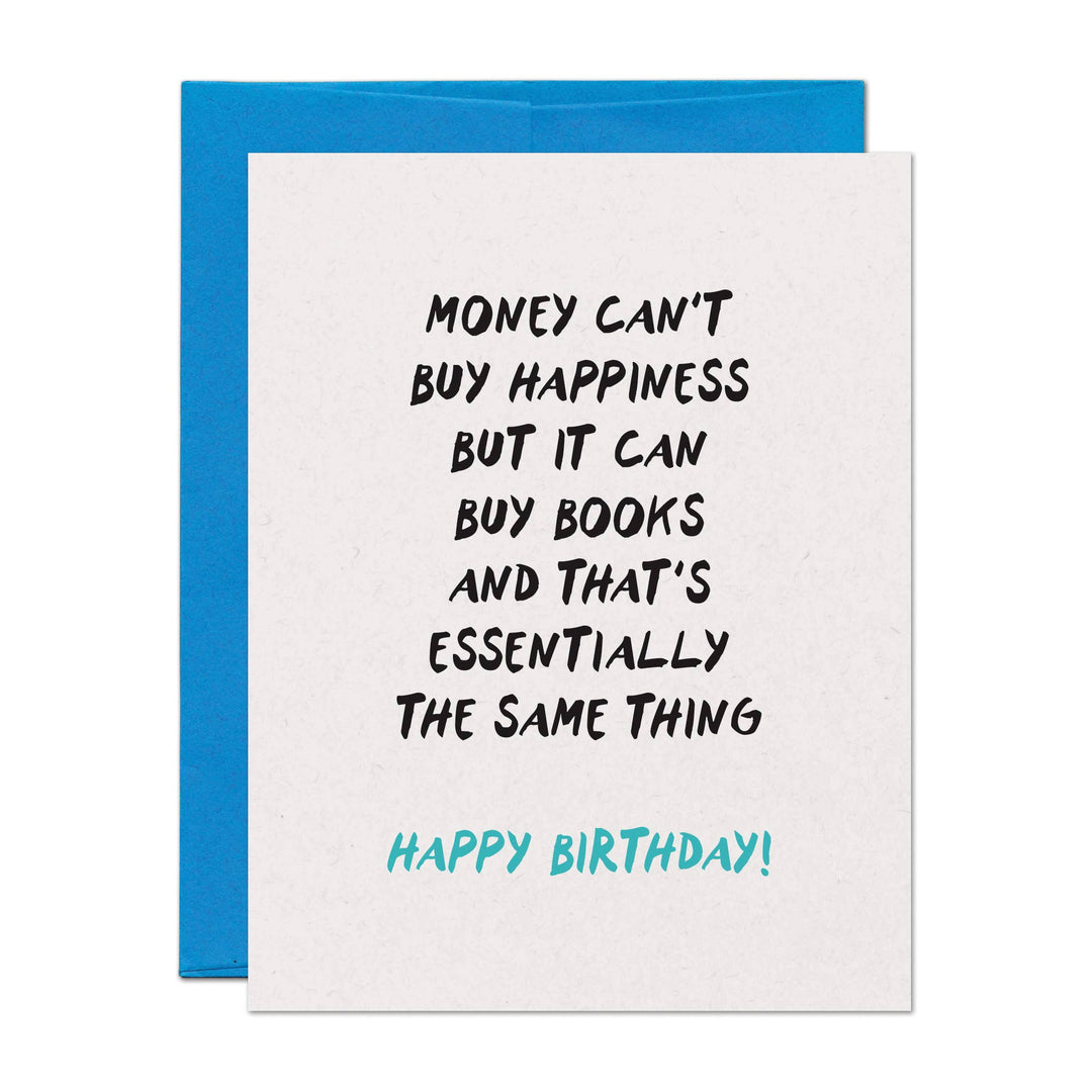 Front of birthday card with the text "Money can't buy happiness but it can buy books and that's essentially the same thing. Happy Birthday!" on a white background with a blue envelope.