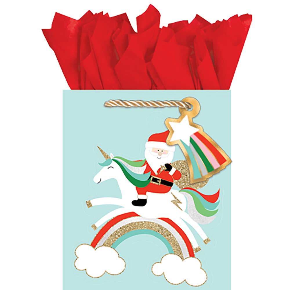 Gift bag with Santa Claus riding a unicorn on a rainbow, red tissue paper inside.