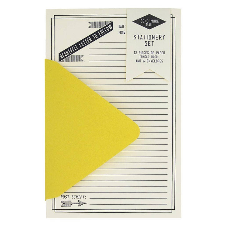 Stationery set with yellow envelope and white paper on a white background