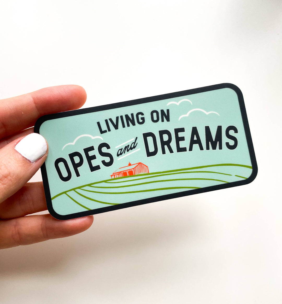 Sticker with 'Living on Opes and Dreams' text