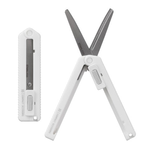Scissor in its case on the left and shown fully open on the right, in white.