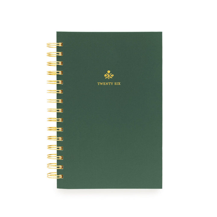 Green cover of planner, with gold spiral binding on the left, and "twenty six" printed in gold.