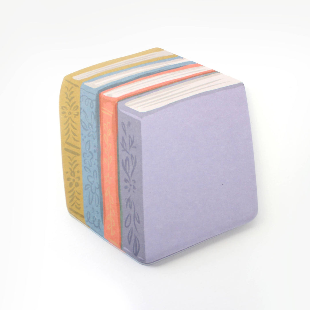 Sticky notes in the shape of four books in yellow, blue, orange, and lilac showing the spine and top.
