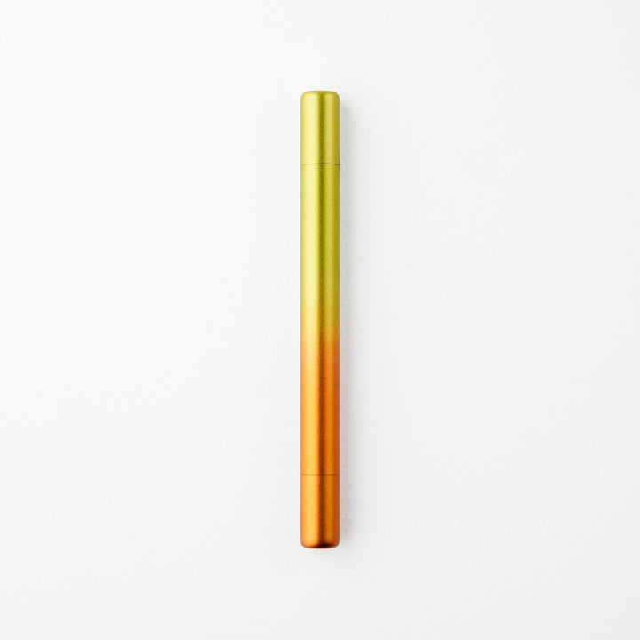 Gradient yellow to orange pen with caps on either end.