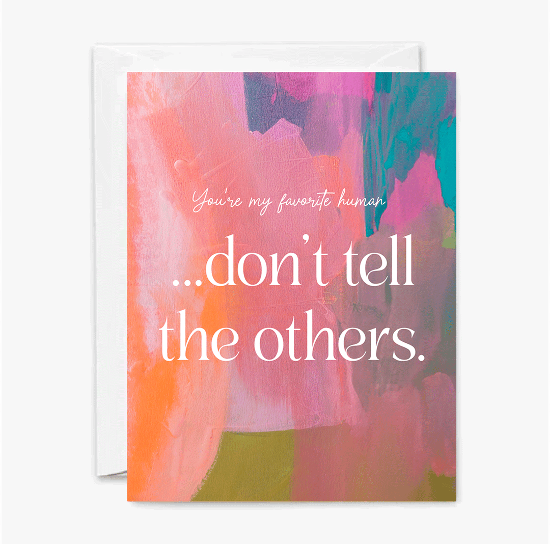 Front of greeting card with colorful abstract in pink, orange and blue, and text 'You're my favorite human...don't tell the others' in white.