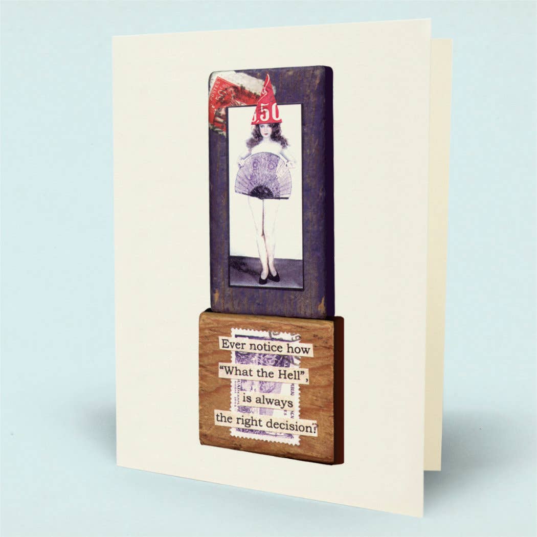 A folded greeting card shown standing upright. The card front features a tall dark rectangular panel with a vintage-style illustration of a woman in a red hat and a white dress, above a brown wood-grain block with a humorous quote about 'What the Hell' being the right decision.