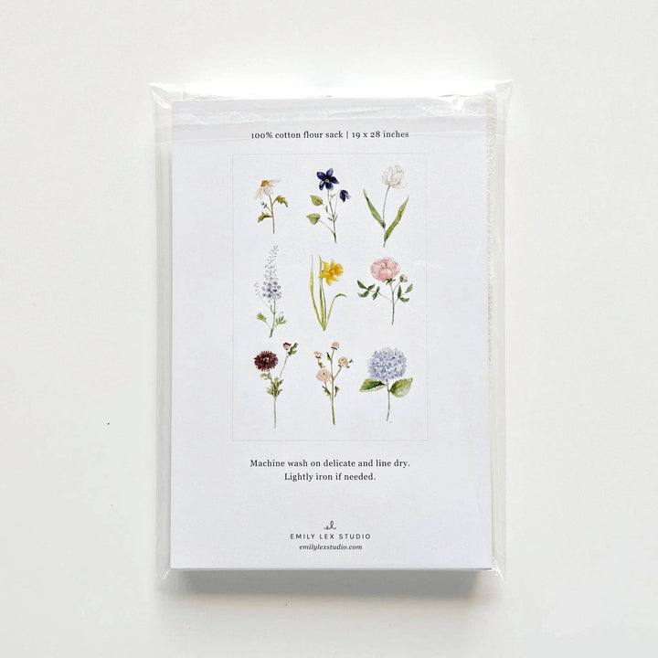Back of package showing the nine different blooms on the towel.