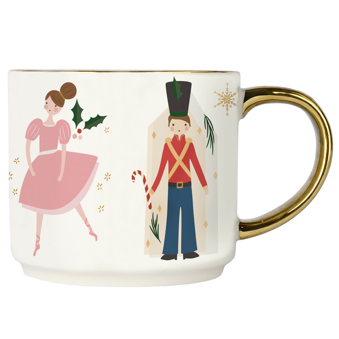 Mug with Nutcracker and Sugar Plum Fairy design on a white background with gold handle.