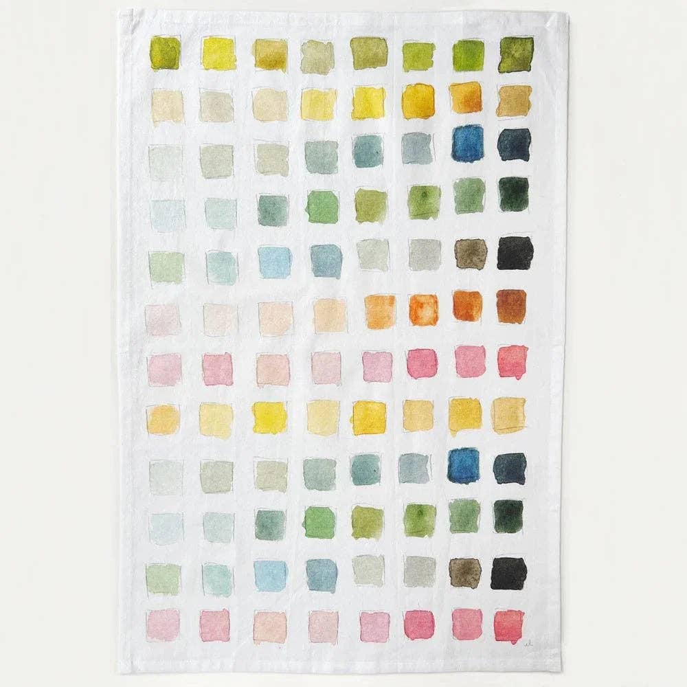Kitchen towel with a grid of squares in different colors. 