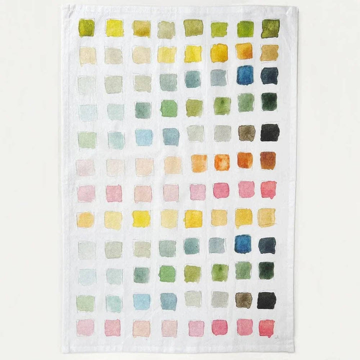 Kitchen towel with a grid of squares in different colors. 