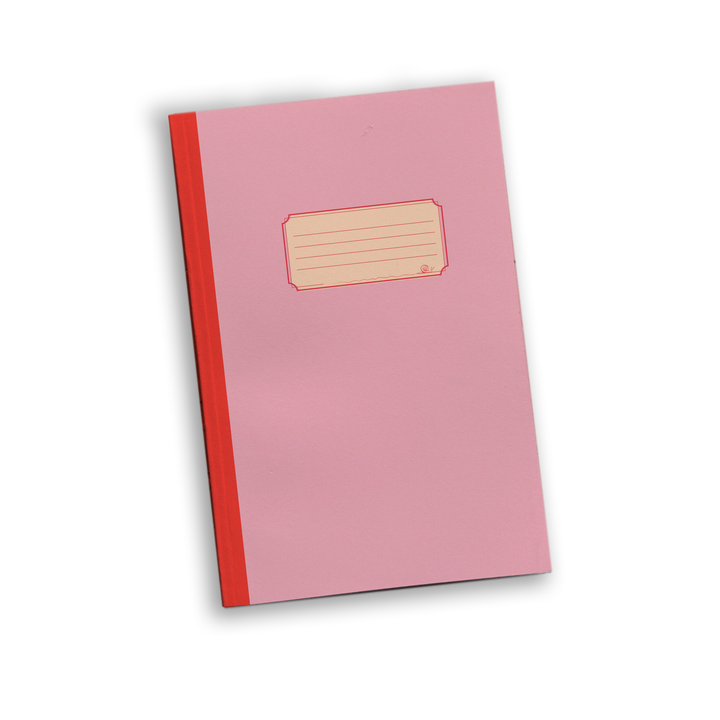 A pink notebook with a red spine and a blank lined label on the cover.
