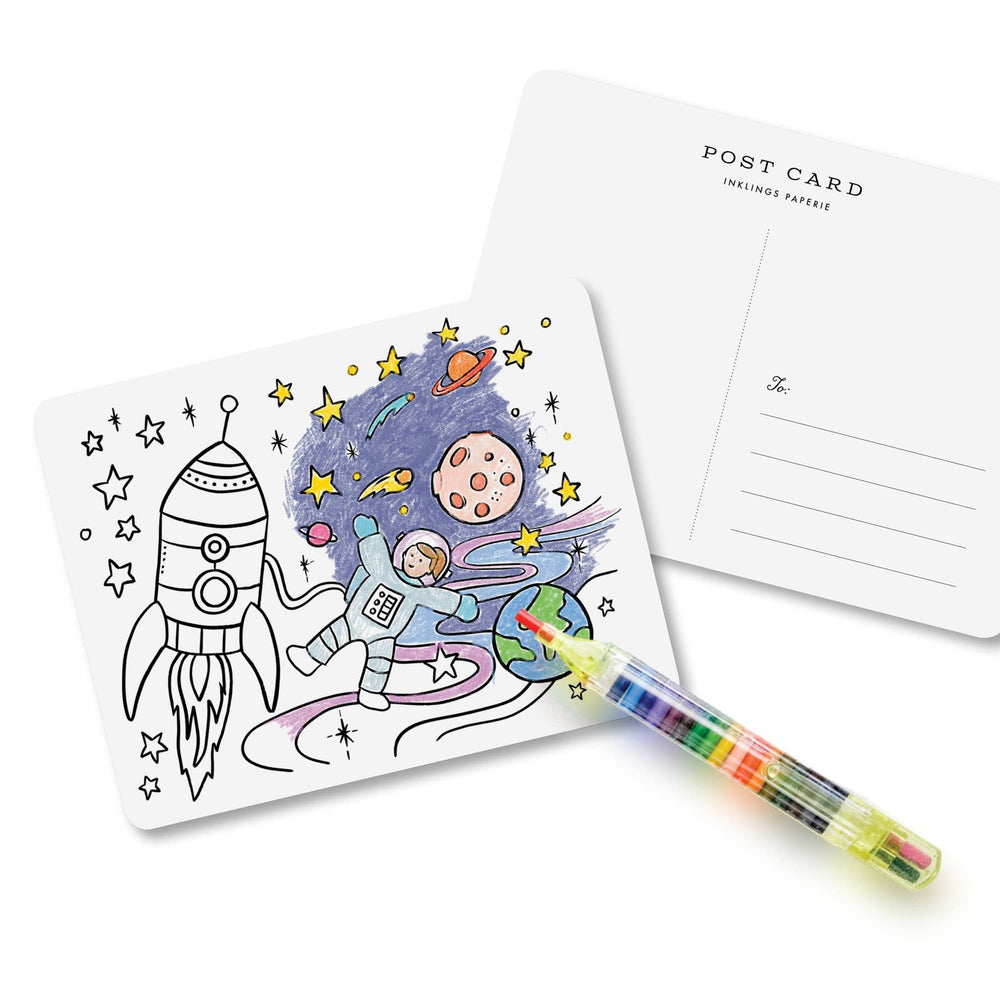 Multi-color marker next to a partially colored space-themed postcard next to the back of the card+