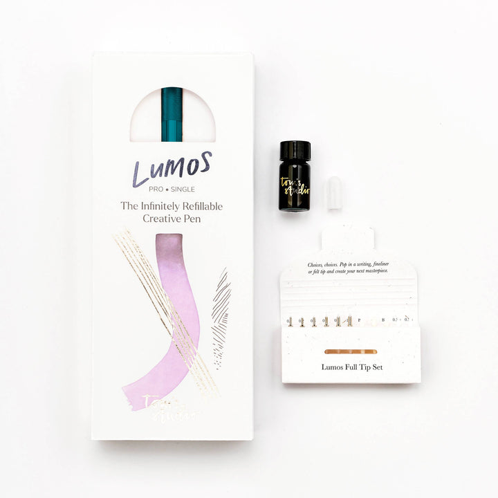 Lumos packaging nest to a container of ink and the box of tips.