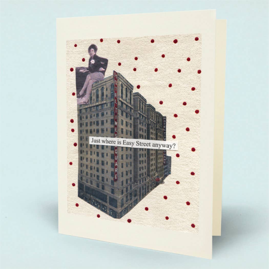 A folded greeting card featuring a collage of a woman sitting on some urban buildings with the text 'Just where is Easy Street anyway?' on a polka dot background.