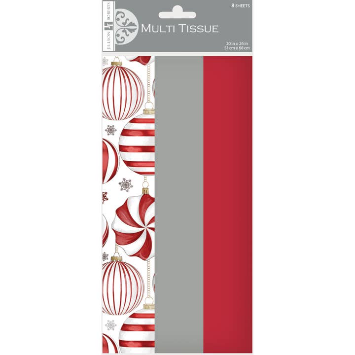 Three styles of tissue paper folded together: red and white ornaments, solid gray and solid red.