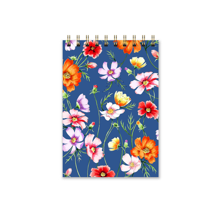 Notebook with colorful floral design on a blue background
