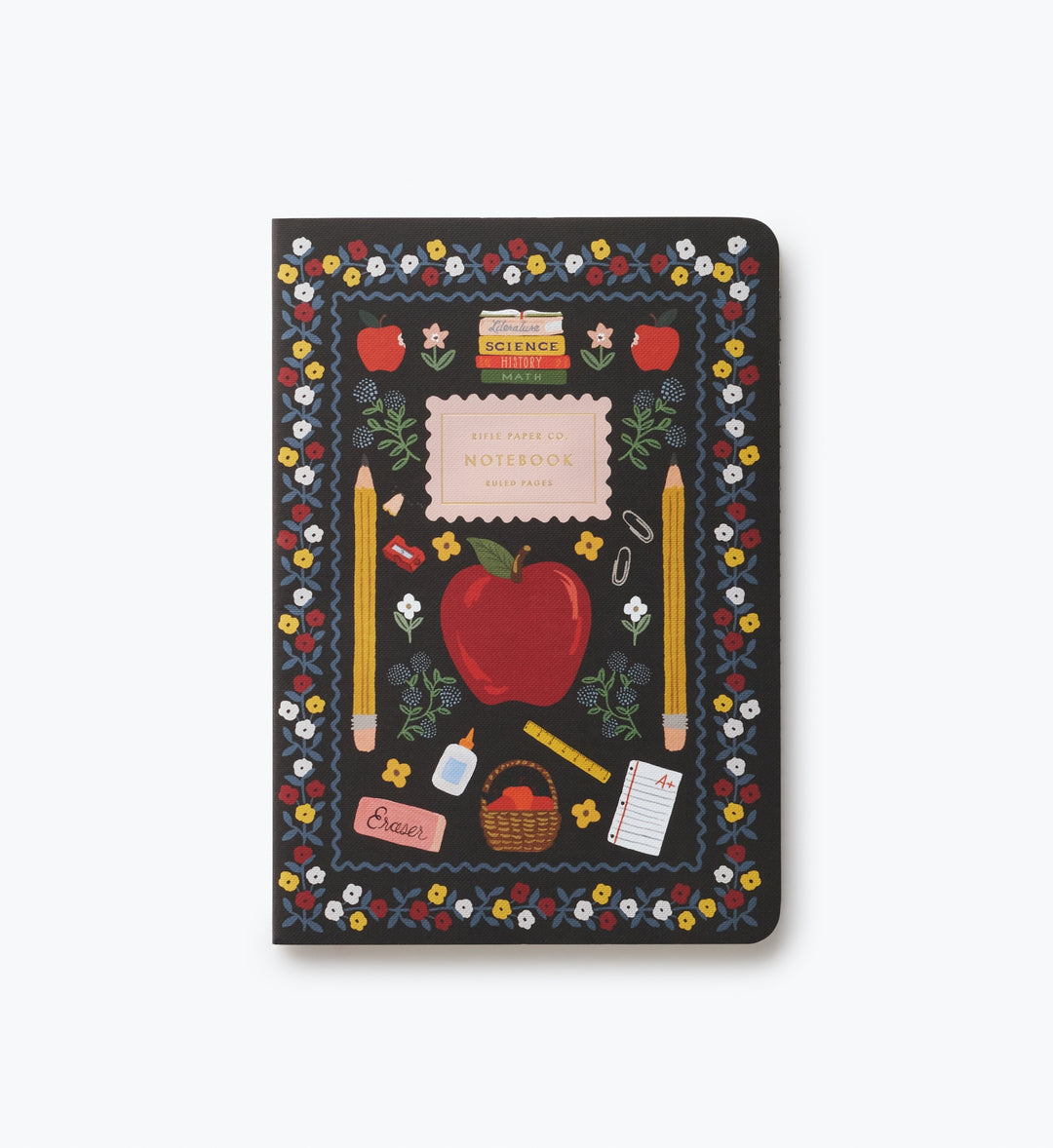 Cover of notebook with pattern of school-related objects, such as apples and pencils, on a black bacground.