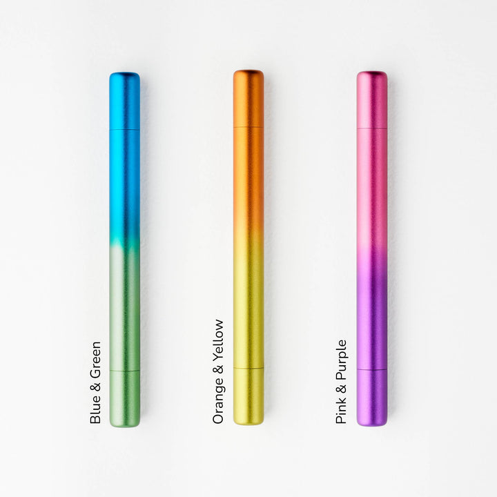 Three gradient colored pens lined up side by side: blue to green, orange to yellow, and pink to purple.