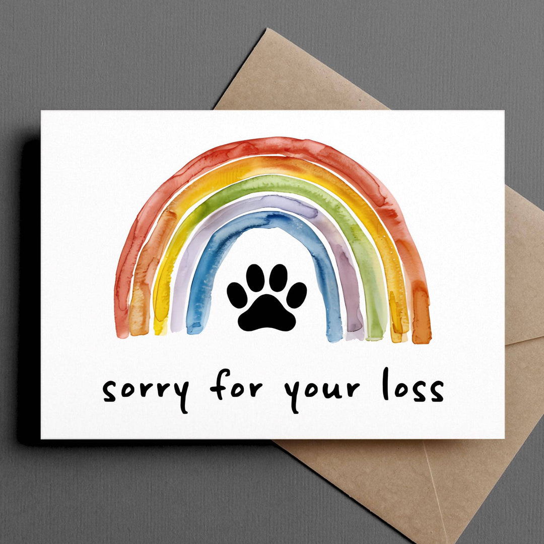 Paw print in the center of a rainbow bridge above the text 'sorry for your loss."