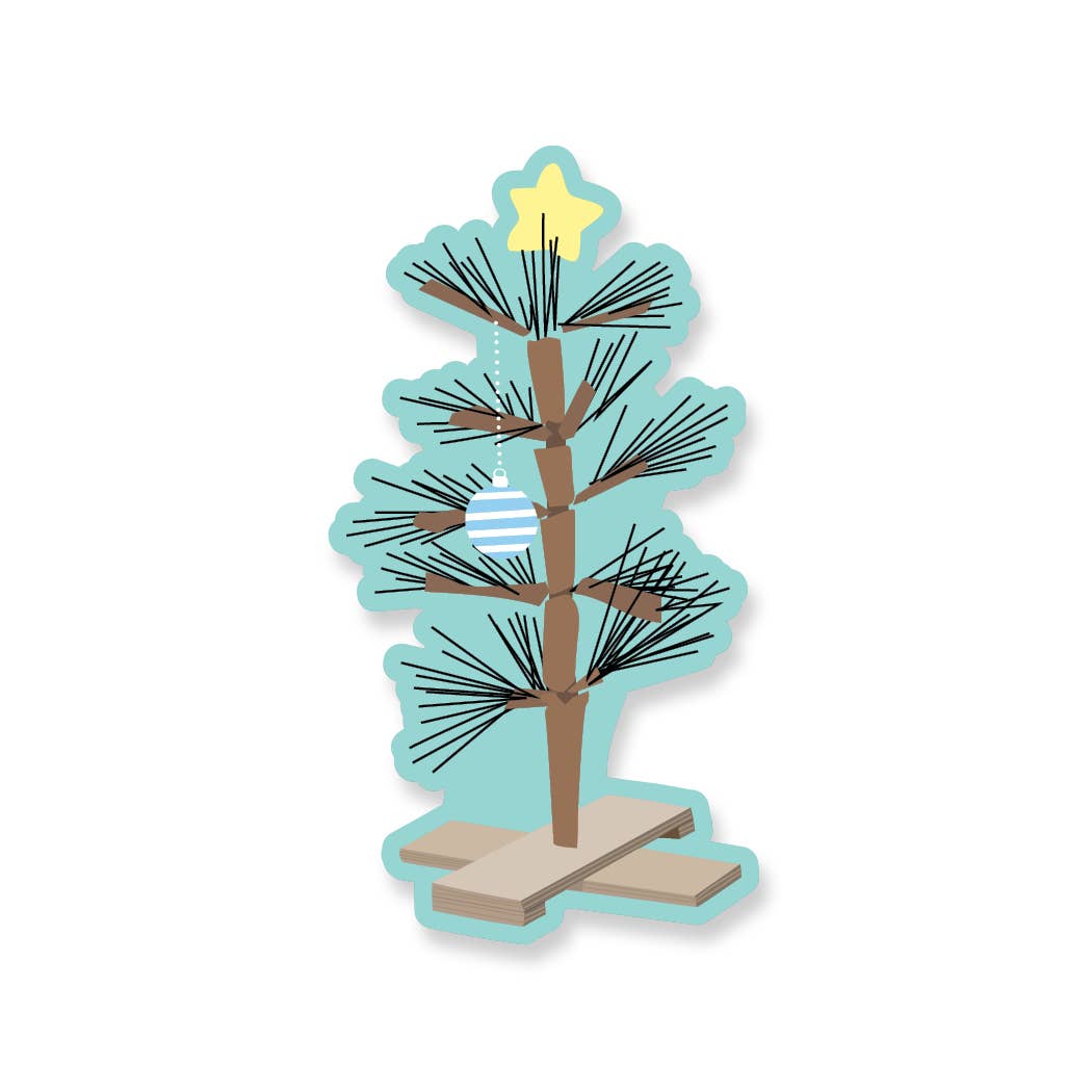 A small "Charlie Brown" tree with one ornament and with a yellow star on top.