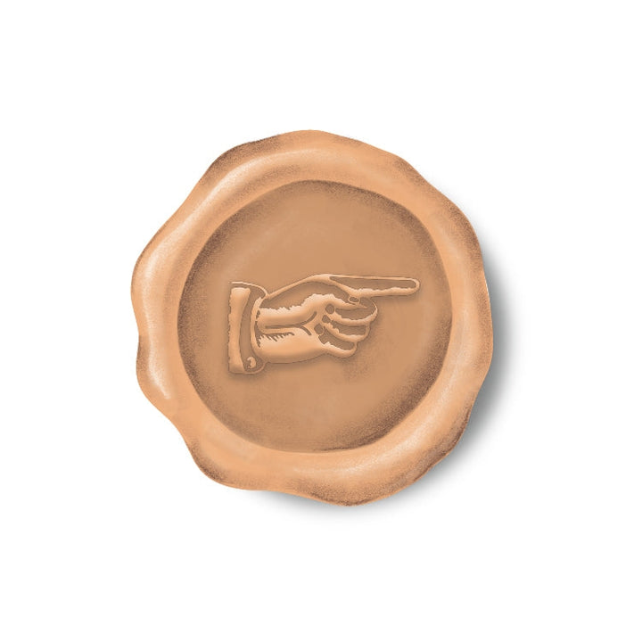 Round sticker resembling a wax seal with manicule in peach.