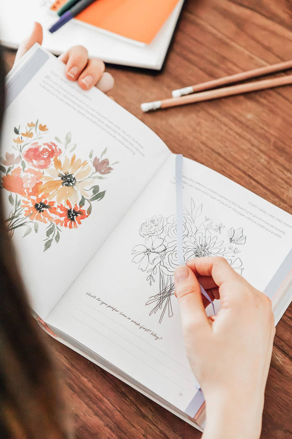 Person coloring a floral design that's one of the daily exercises presented in the book.