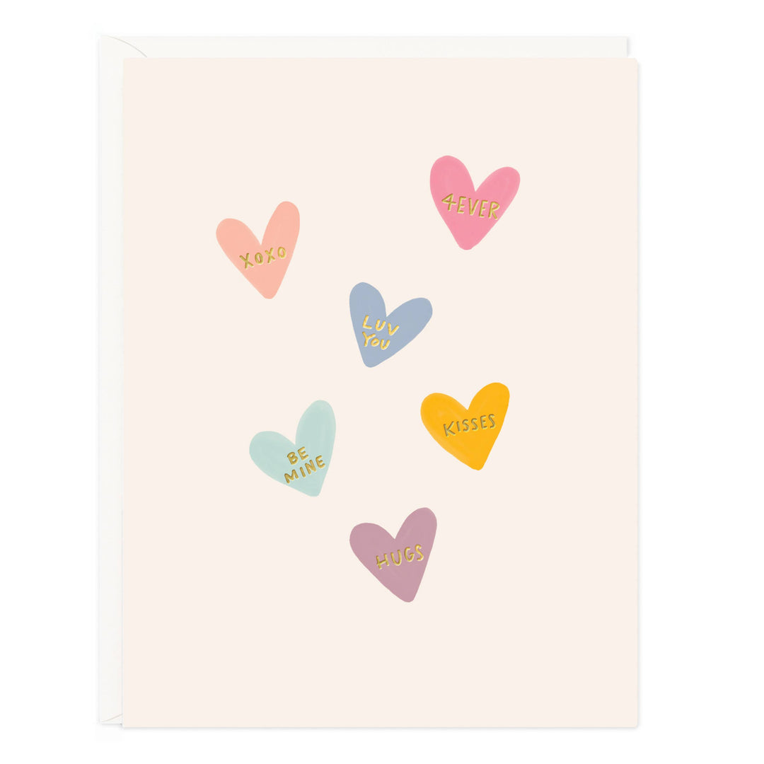 Front of card with colorful heart shapes with various sentiments on a light background with white envelope.
