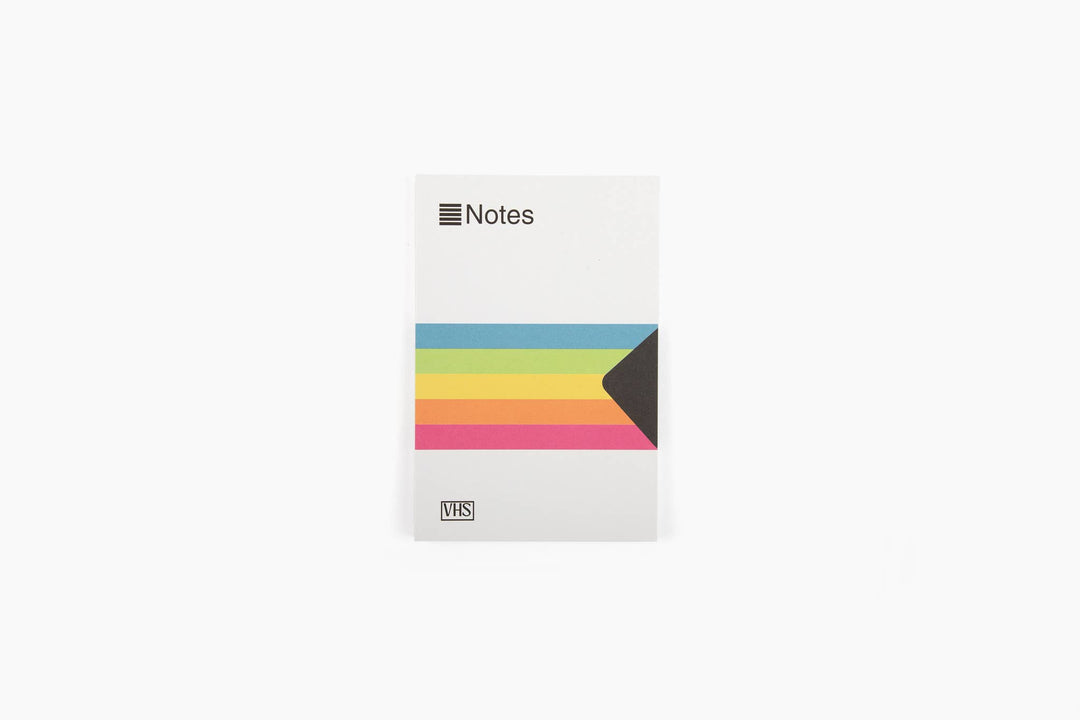 Notepad resembling a classic VHS  box with "Notes" at the top, a block of rainbow colors in the middle and the marking "VHS" in the lower left.