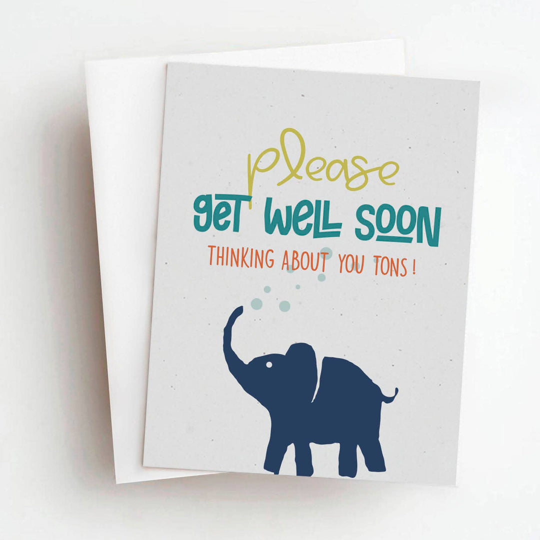 Front of get well soon card with a silhouette of an elephant below text in yellow, teal and red, on a white card stock.