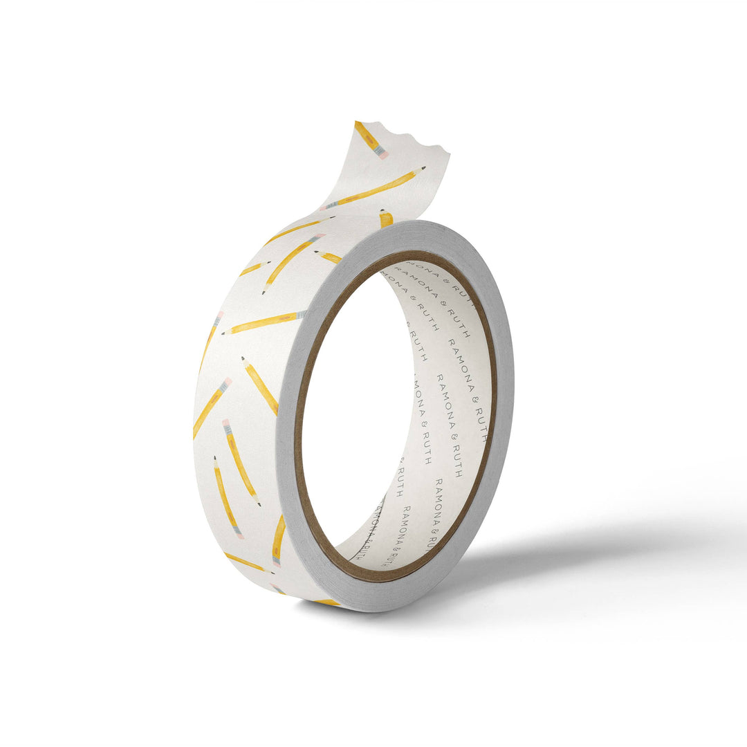 Sharpened yellow pencils scattered on a white background.