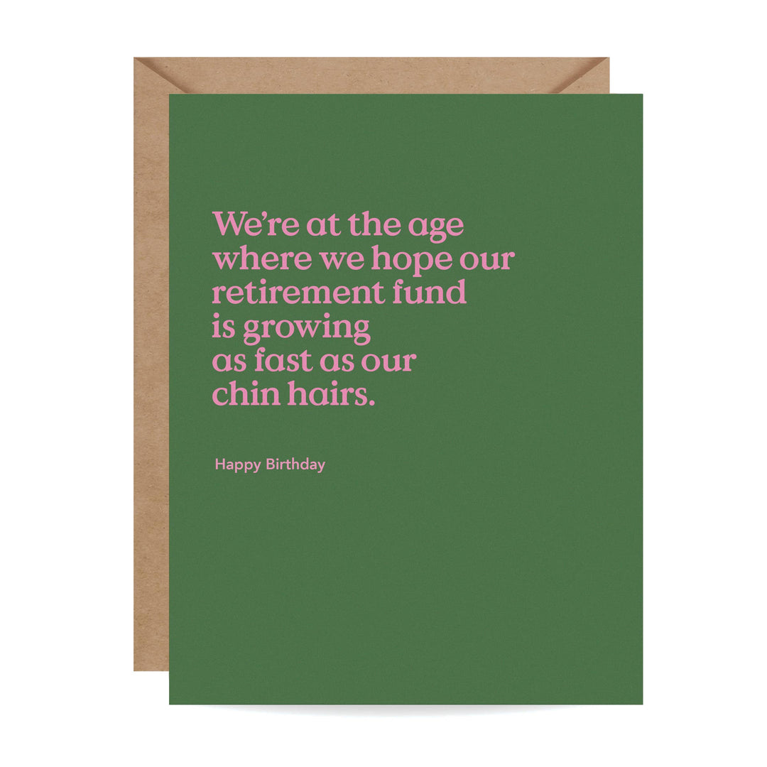 Front of birthday card with pink text on a green background, with a Kraft brown envelope.