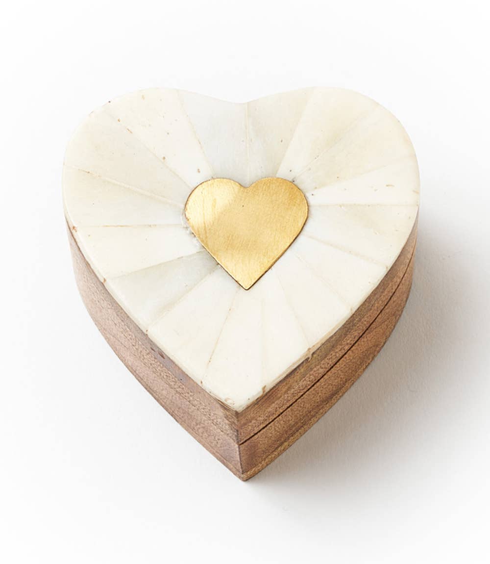 Mango wood box, closed, with brass heart in the center of the bone lid.