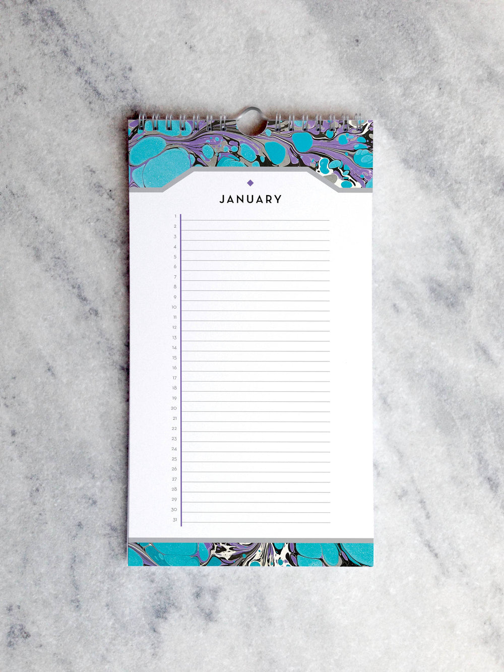 Page for January with marbled paper in shades of turquoise and purple at the top and bottom. Below the month title is a line for each day of the month.