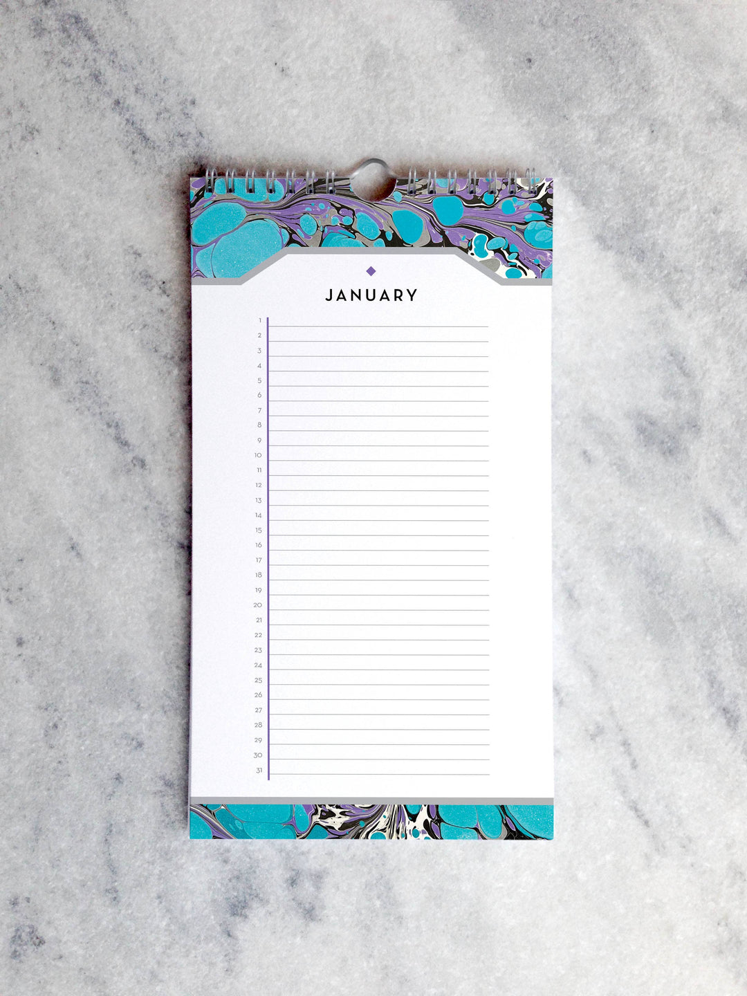 Page for January with marbled paper in shades of turquoise and purple at the top and bottom. Below the month title is a line for each day of the month.