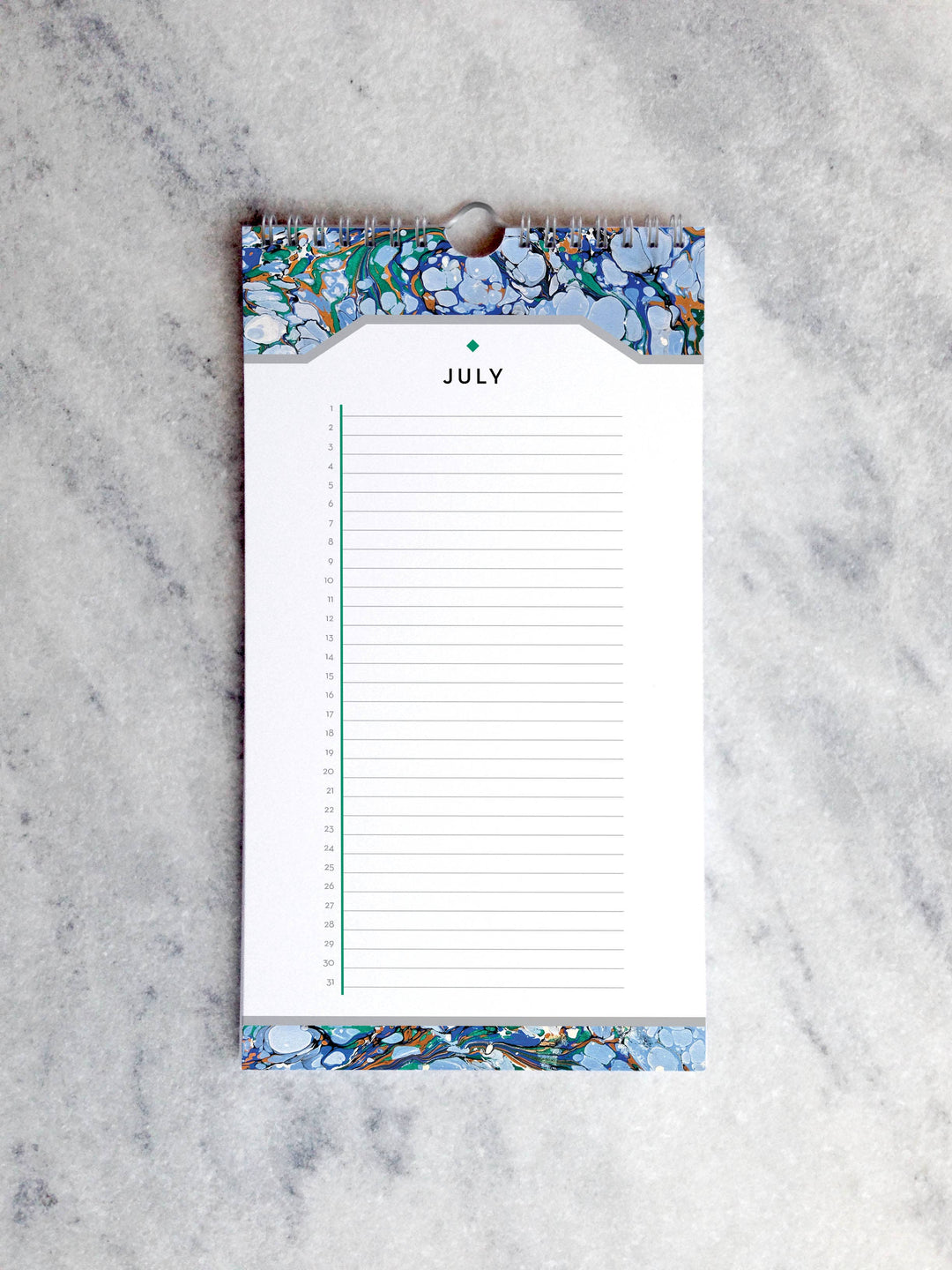 Page for July with marbled paper in shades of blue at the top and bottom. Below the month title is a line for each day of the month.