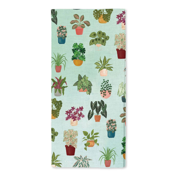 A variety of houseplants drawn on a green cotton kitchen towel.