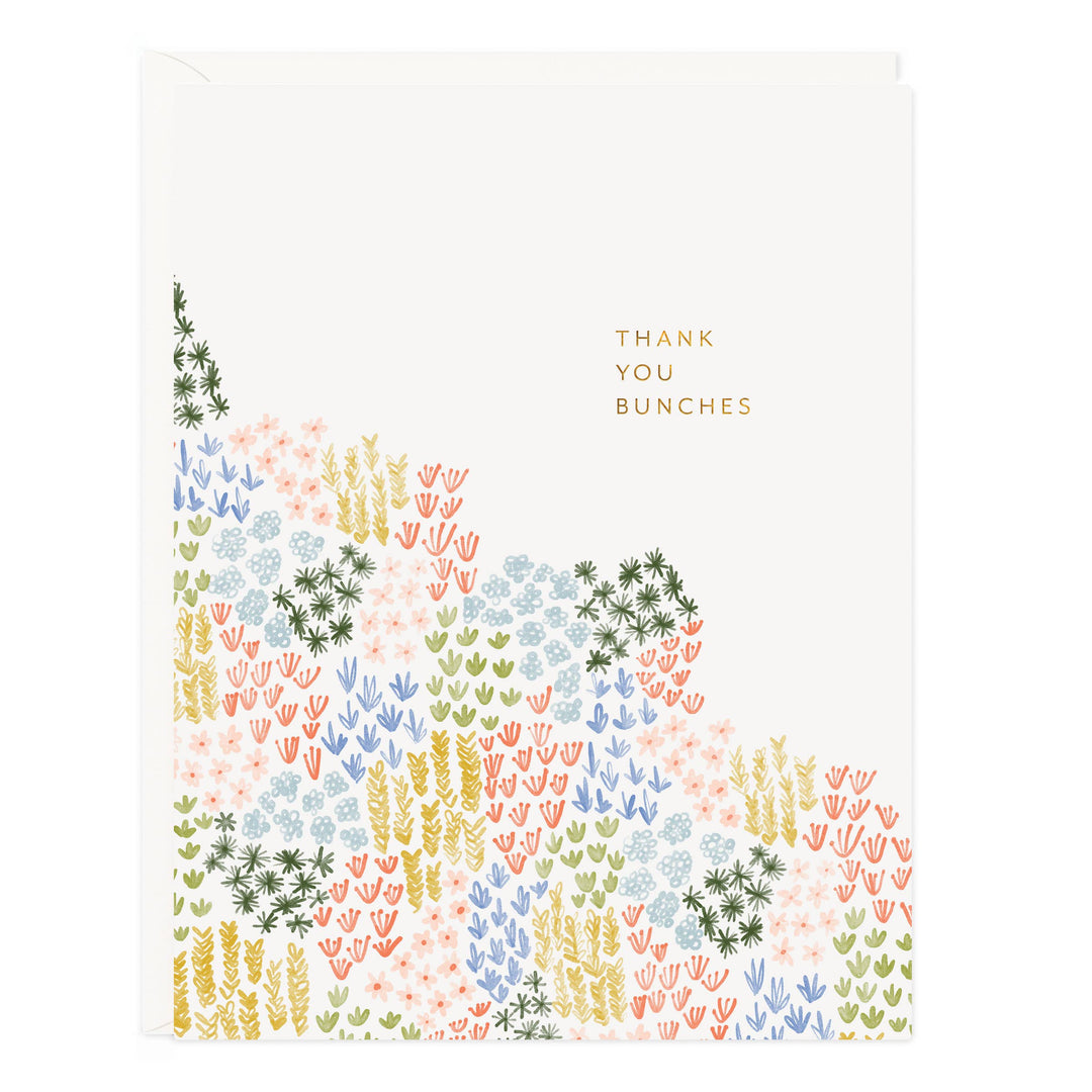 Front of car with a meadow of various colored flowers and the text 'thank you bunches.'