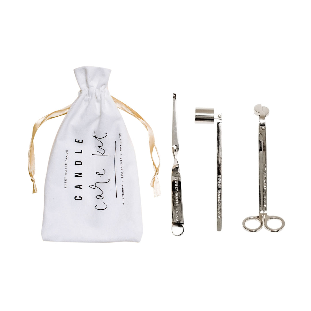 Candle care kit bag and wick dipper, candle snuffer, and wick trimmer in silver.