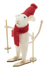 Felt white mouse wearing a red scarf on skis and holding ski poles. 