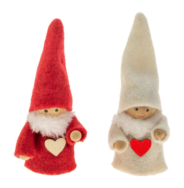 Two small figurines with tall pointy hat,  red with beard or beige with scarf, holding a heart.