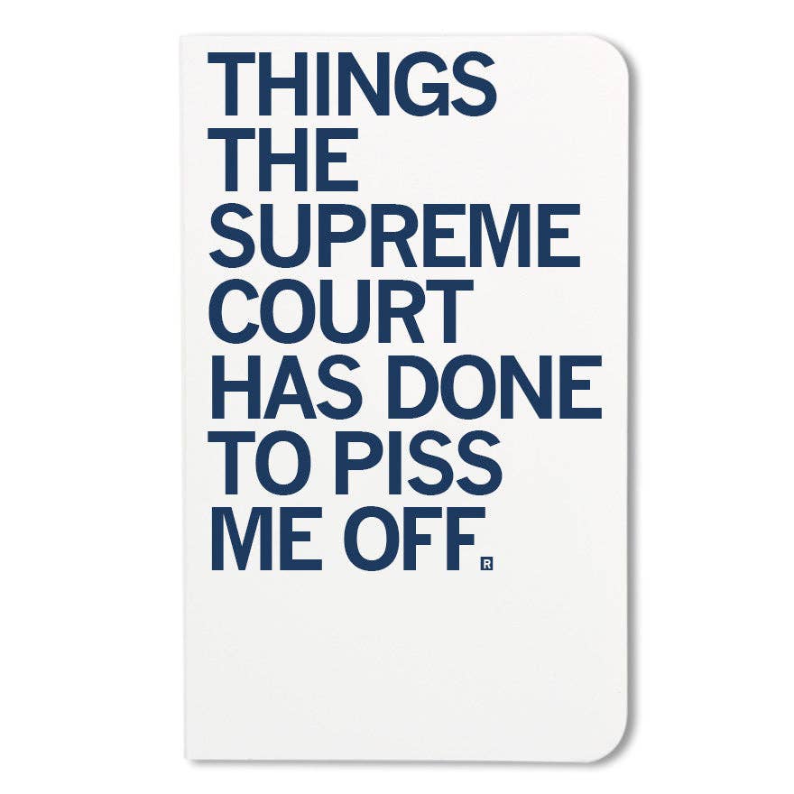 Notebook with large black text 'in capital letters on a white background