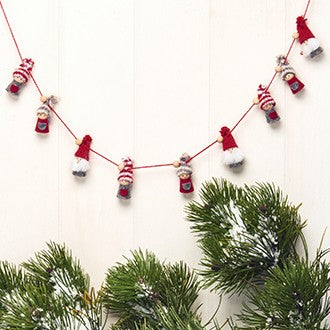 Garland of three styles of pixies on a 55" red rope. 