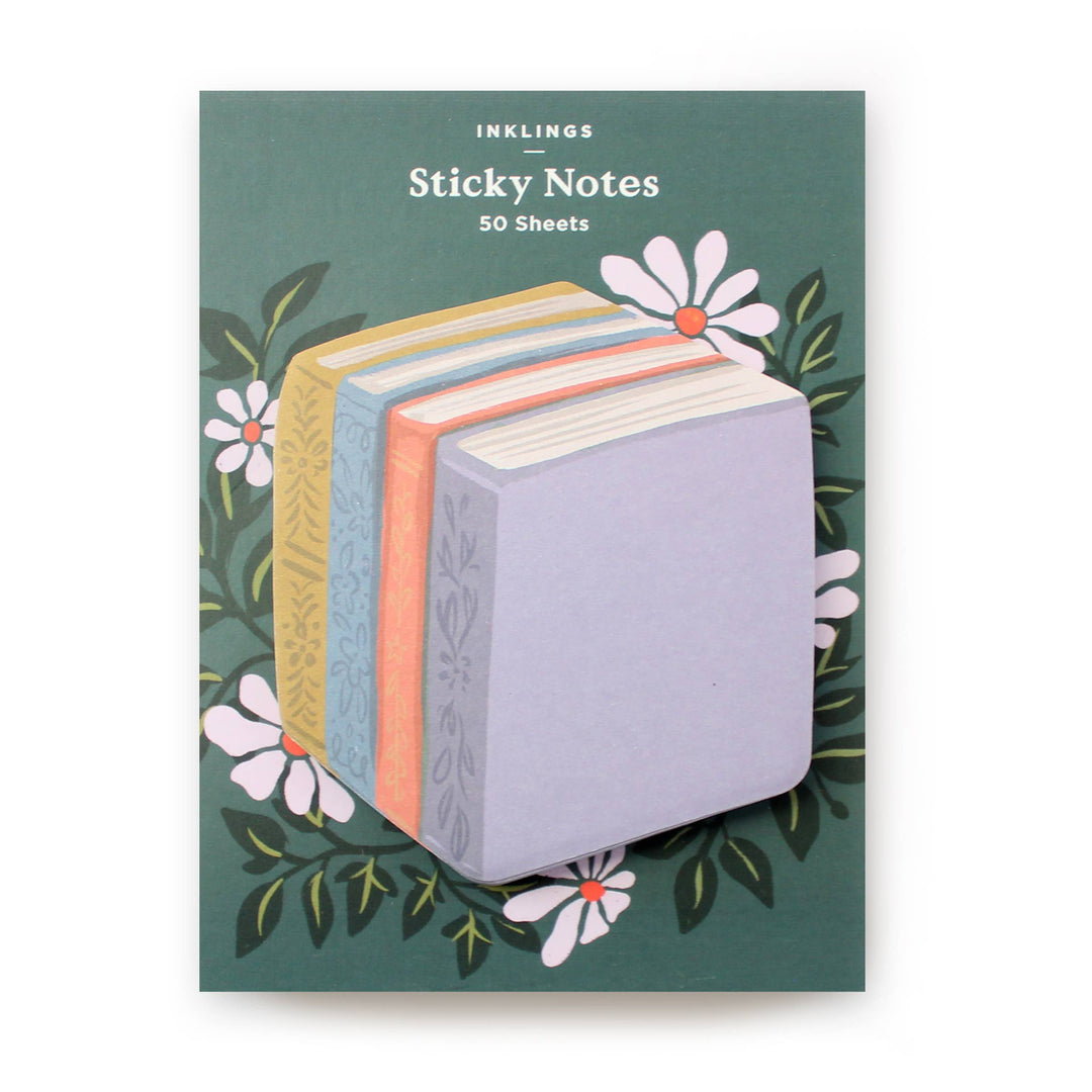 Sticky notes in the shape of a group of four books on a package with daisies.