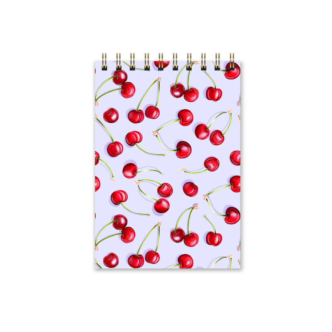 Notebook with cherry pattern on a white background