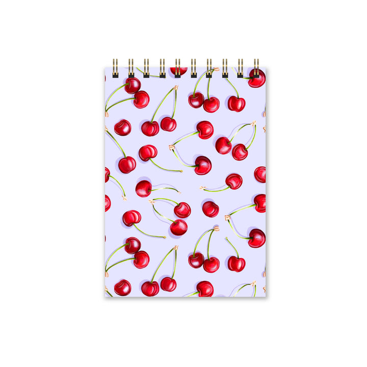 Notebook with cherry pattern on a white background