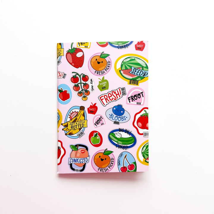 Sticker book with colorful fruit and vegetable graphics on a pink cover 