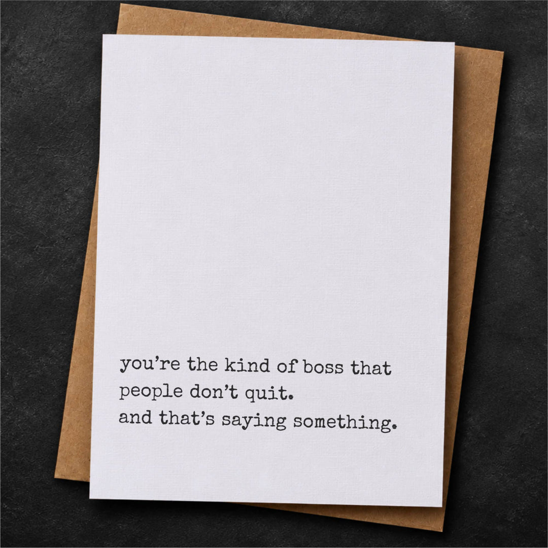 A white greeting card with black typewriter-style text reading, 'you're the kind of boss that people don't quit. and that's saying something.